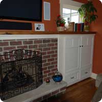 Reclaimed oak fireplace mantel and matching cabinets