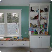 Boys room window seat and bookcase