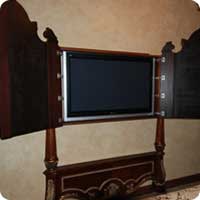TV cabinet designed to match the bed's headboard