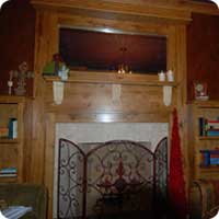 Reclaimed oak bookcase and beveled mirror mantel